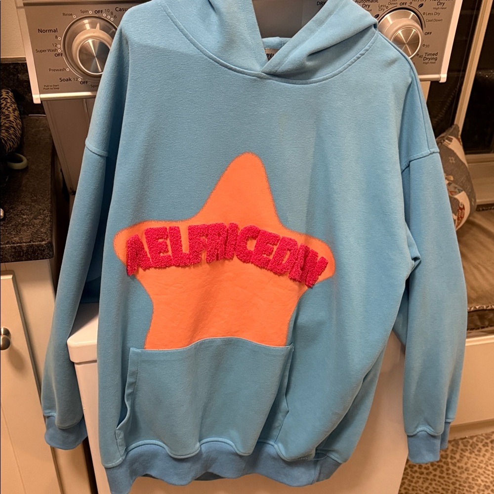 Aelfric Eden Blue Hoodie with Orange Star and Pink Text